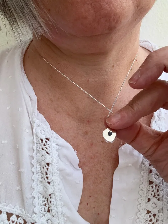 Blue Sea Glass Bezel Necklace detailed with heart