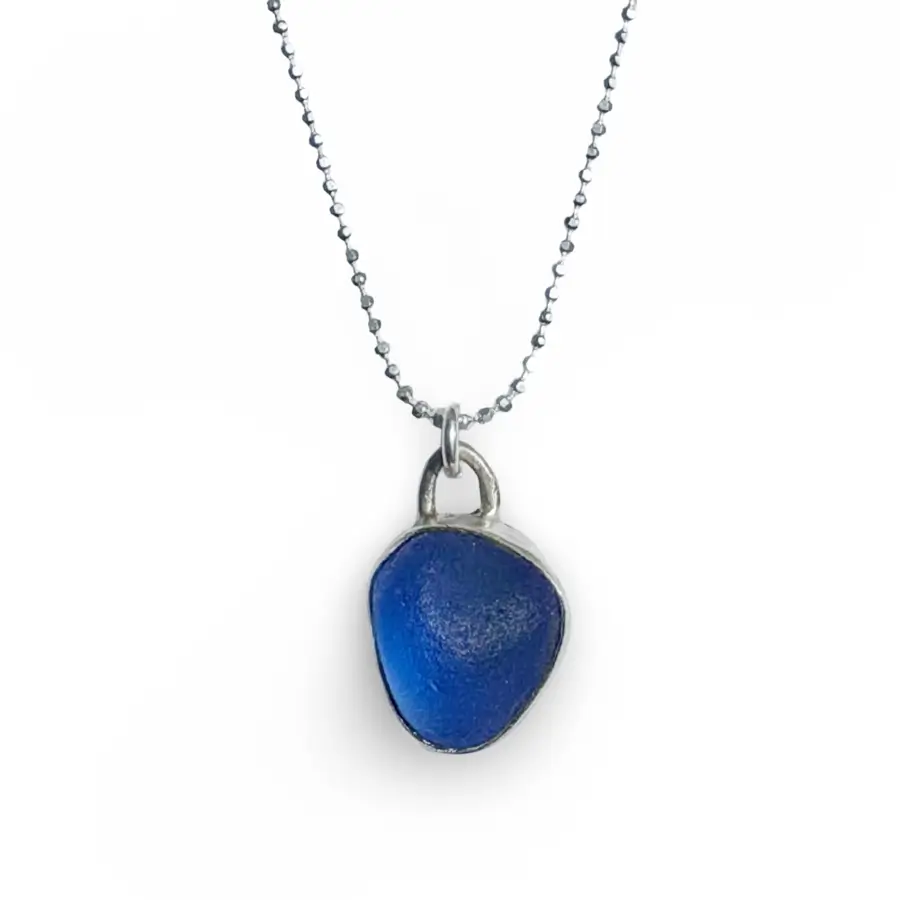 Blue Sea Glass Bezel Necklace handmade by AfricanDreamland in Barcelona.